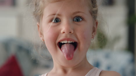 portrait-cute-little-girl-playfully-making-faces-looking-looking-at-camera-having-fun-naughty-child-enjoying-funny-expressions-of-happy-kid-4k