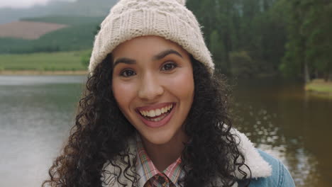 portrait-beautiful-mixed-race-woman-laughing-looking-happy-wearing-beanie-enjoying-cold-winter-outdoors-in-nature-by-lake-real-people-4k