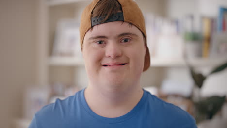 smiling-boy-with-down-syndrome-happy-special-needs-teenager-with-disability-at-home-testimonial-concept-4k