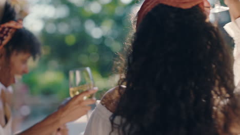 beautiful-woman-dancing-with-friends-at-summer-dance-party-drinking-wine-enjoying-summertime-social-gathering-having-fun-celebrating-on-sunny-day-4k-footage