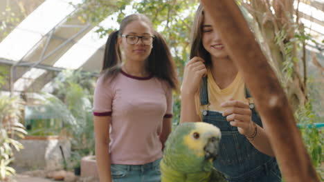 funny-teenage-girls-afraid-to-touch-parrot-nervous-students-learning-about-birds-enjoying-excursion-to-wildlife-sanctuary-4k-footage