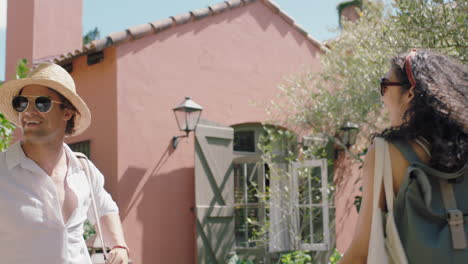 travel-couple-arriving-at-hotel-villa-with-friends-looking-at-beautiful-country-house-excited-for-holiday-tourists-enjoying-summer-vacation-together-4k-footage