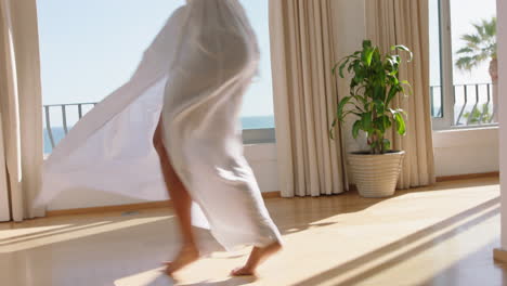 travel-woman-dancing-in-hotel-room-having-fun-celebrating-summer-vacation-enjoying-carefree-holiday-lifestyle