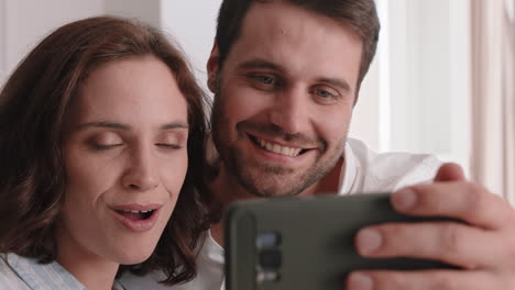 happy-couple-having-video-chat-using-smartphone-chatting-to-friend-smiling-excited-enjoying-online-communication-on-mobile-phone