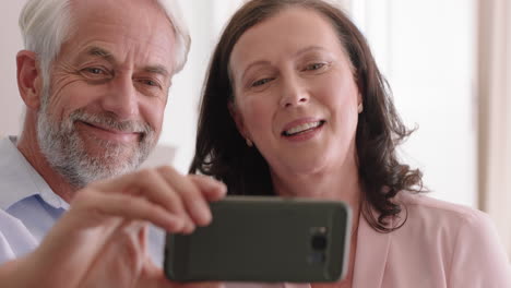 happy-middle-aged-couple-using-smartphone-having-video-chat-waving-at-grandchildren-enjoying-online-communication-relaxing-retirement-home