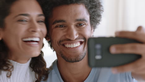 happy-mixed-race-couple-using-smartphone-video-chatting-to-friend-smiling-excited-enjoying-online-communication