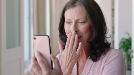mature-woman-having-video-chat-using-smartphone-waving-at-baby-smiling-enjoying-connection-grandmother-chatting-on-mobile-phone