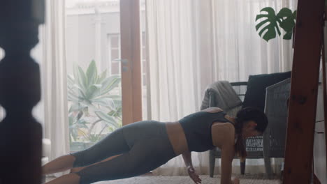 healthy-asian-woman-exercising-at-home-practicing-side-plank-in-living-room-enjoying-morning-fitness-workout