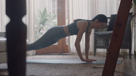 healthy-asian-woman-exercising-at-home-practicing-push-ups-in-living-room-enjoying-morning-fitness-workout