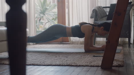 healthy-asian-woman-exercising-at-home-practicing-in-living-room-enjoying-morning-fitness-workout
