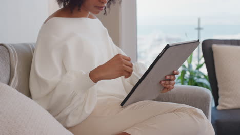 attractive-young-woman-using-digital-tablet-computer-working-at-home-browsing-email-messages-with-stylus-pen-enjoying-mobile-device-technology