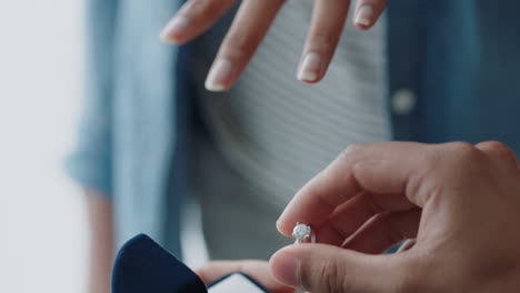 close-up-hands-marriage-proposal-young-man-proposing-to-girlfriend-putting-wedding-ring-on-her-finger-with-beautiful-diamond-expressing-romantic-commitment