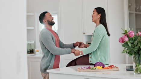 Love,-cooking-and-couple-holding-hands-in-kitchen