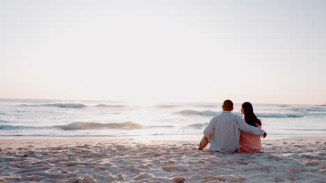 Couple,-beach-and-relax-at-sunset-on-vacation