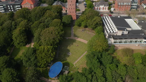 Top-down-view-of-the-cliff-of-Water-Tower-in-Esbjerg,-Denmark.-The-hill-is-built-in-shape-of-a-greek-theatre-and-is-nearby-the-Esbjerg-Kunstmuseum,-the-Art-museum