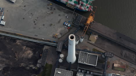 Top-down-view-over-the-chimney-of-the-power-station-in-Esbjerg,-Denmark.-Overhead-view-of-coal-and-oil-fueled-power-plant's-chimney,-the-tallest-in-scandinavia