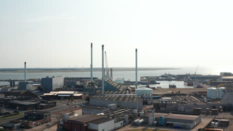 Aerial-view-of-chimneys-of-petrochemical-industries-in-Esbjerg,-Denmark,-seaport.-The-Esbjerg-seaport-is-one-of-the-most-important-port-in-North-Sea-for-oil-and-gas-fields