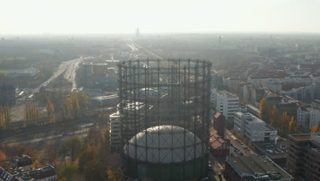 Cityscape-of-Berlin-on-bright-Sunny-Autumn-Day,-Gasometer-in-Schoeneberg,-Aerial-View