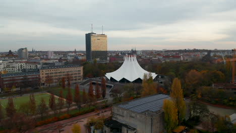 Flight-through-Part-of-Berlin,-Germany-with-Buildings-and-View-of-Tempodrom-Event-Space,-Aerial-Drone-Wide-Angle-View
