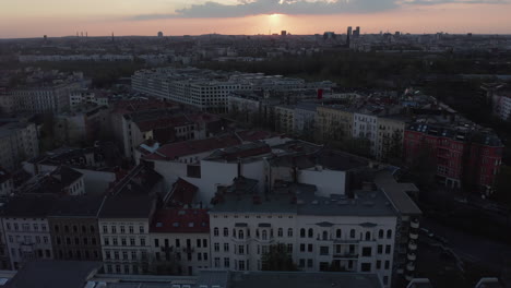 AERIAL:-Beautiful-Wide-View-over-Dark-Berlin-Cityscape-during-Sunset
