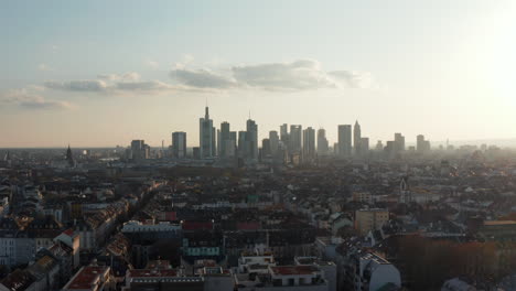 Aerial-tracking-view-of-cityscape-with-skyscrapers.-Skyline-against-bright-sky.-Frankfurt-am-Main,-Germany