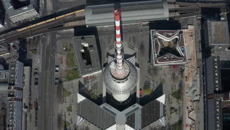 AERIAL:-Wide-View-of-Empty-Berlin,-Germany-Alexanderplatz-TV-Tower-with-almost-No-People-or-Cars-on-Beautiful-Sunny-Day-During-COVID-19-Coronavirus-Pandemic