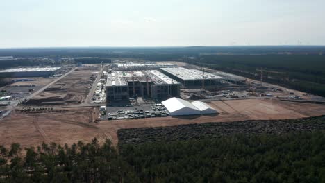 Big-Building-Construction-Site-in-Nature-Area-in-Europe,-Aerial-Drone-Perspective-Wide-View