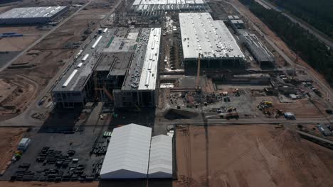 High-Angle-View-of-Construction-Site-for-Factory-in-Germany,-Rural-Area-near-Berlin,-Tesla-Gigafactory-from-above,-Aerial