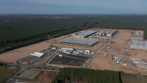 Aerial-Dolly-slide-left-above-Huge-Construction-Building-Site-in-Europe-rural-landscape,-Germany-in-development