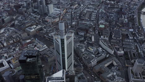 High-angle-footage-of-Commerzbank-Tower.-High-rise-office-building-with-antenna-on-top.-Town-development-in-background.-Frankfurt-am-Main,-Germany