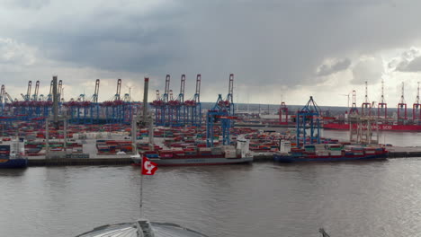 Aerial-view-of-many-cargo-ships-and-cranes-with-containers-in-Hamburg-port