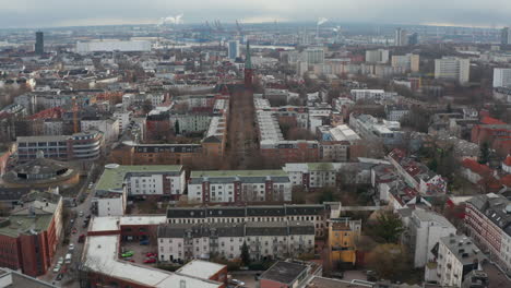 Aerial-view-of-houses-in-residential-neighborhoods-and-old-church-in-Hamburg-city-center