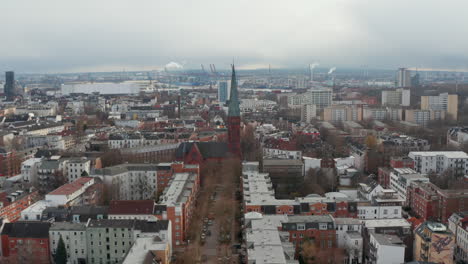 Aerial-view-of-St-Peters-church-in-Hamburg-surrounded-by-urban-apartment-buildings