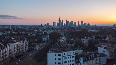 Low-slider-view-of-building-rooftops-during-beautiful-golden-hour-sunset-in-residential-suburb-Bornheim-of-Frankfurt-am-Main-city-Skyline-in-Germany