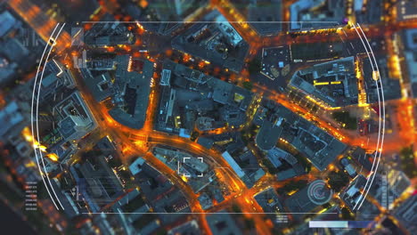 Top-down-shot-of-buildings-and-illuminated-streets-in-urban-borough-in-evening.-Augmented-reality-showing-additional-info-for-targeted-objects.-Frankfurt-am-Main,-Germany