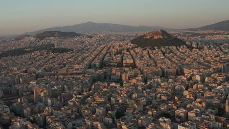 Slow-Establishing-Dolly-Aerial-towards-Mount-Lycabettus-in-Athens,-Greece