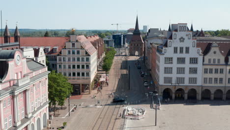 Slide-and-pan-footage-street-in-historic-centre-of-city.-Old-typical-houses-with-arcades-and-Steintor-town-gate