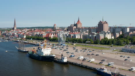 Aerial-panoramic-view-of-waterfront-and-landmarks-in-historic-city-centre.-Church-towers-towering-above-buildings