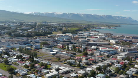 Drone-view-of-Reykjavik,-iceland-capital-city,-with-colorful-house-roofs.-Aerial-view-of-the-old-harbor-near-the-city-centre,-mainly-used-by-fishermen-and-cruise-ships.-Travel-destination