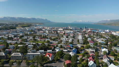 Birds-eye-view-of-Reykjavik,-capital-and-largest-city-in-Iceland,-on-the-shore-of-Faxafloi-Bay.-Aerial-view-of-the-old-harbor-near-the-city-centre,-mainly-used-by-fishermen-and-cruise-ship