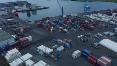 Drone-view-of-containers-ready-to-be-shipped-in-Reykjavik-Sundahofn-harbor,-Iceland.-Life-of-trading-port.-Aerial-view-of-largest-cargo-port-in-Iceland,-located-in-east-side-of-Reykjavik