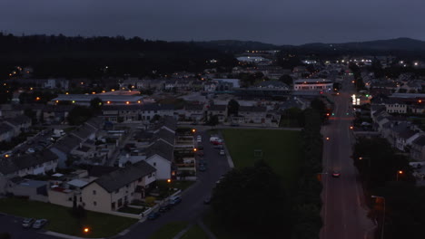 Aerial-footage-of-residential-houses-in-suburbs.-Fly-above-rows-of-buildings-at-dusk.-Killarney,-Ireland