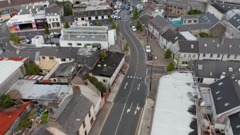 High-angle-view-of-street-and-crossroads-in-town.-Various-buildings-along-road.-Cars-driving-in-town-centre.-Ennis,-Ireland