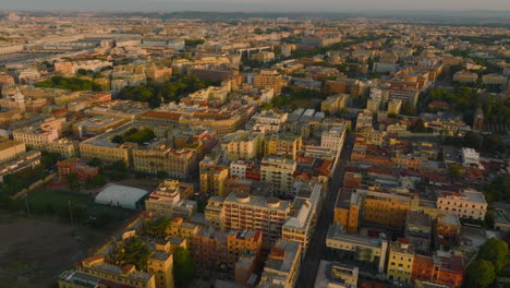 Aerial-panoramic-footage-of-colour-multistorey-apartment-buildings-in-residential-urban-borough-at-sunrise.-Rome,-Italy