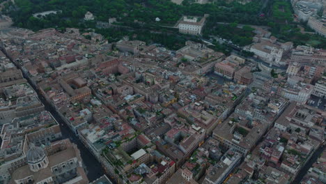 Beautiful-high-angle-view-of-blocks-of-historic-buildings-in-city-centre.-Aerial-view-of-town-development-at-twilight.-Rome,-Italy