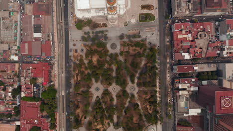 Aerial-birds-eye-overhead-top-down-panning-view-of-public-urban-park-Alameda-Central-and-Palacio-de-Bellas-Artes-museum-building.-Mexico-city,-Mexico.