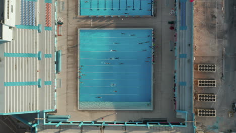 Epic-view-of-training-Swimmers-doing-lanes-in-Blue-Pool-in-Sunshine,-SEPTEMBER-9th-2020