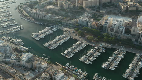 Multiple-Yachts-and-Sailboats-Yacht-port-on-Malta-in-beautiful-sunlight,-Aerial-View