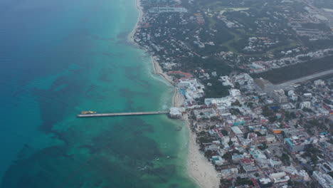 Aerial-view-with-the-pier-at-Playa-del-Carmen.-Yellow-passenger-boat-docked-at-the-pier