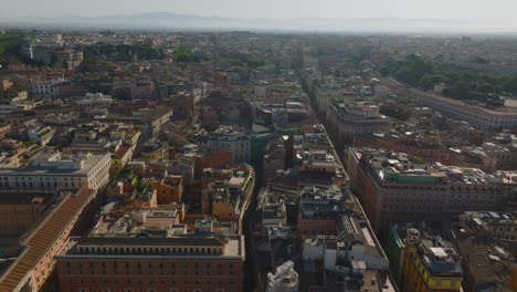 Forward-fly-above-city-in-morning.-Streets,-old-palaces-and-tourist-landmarks-in-historic-city-centre.-Rome,-Italy